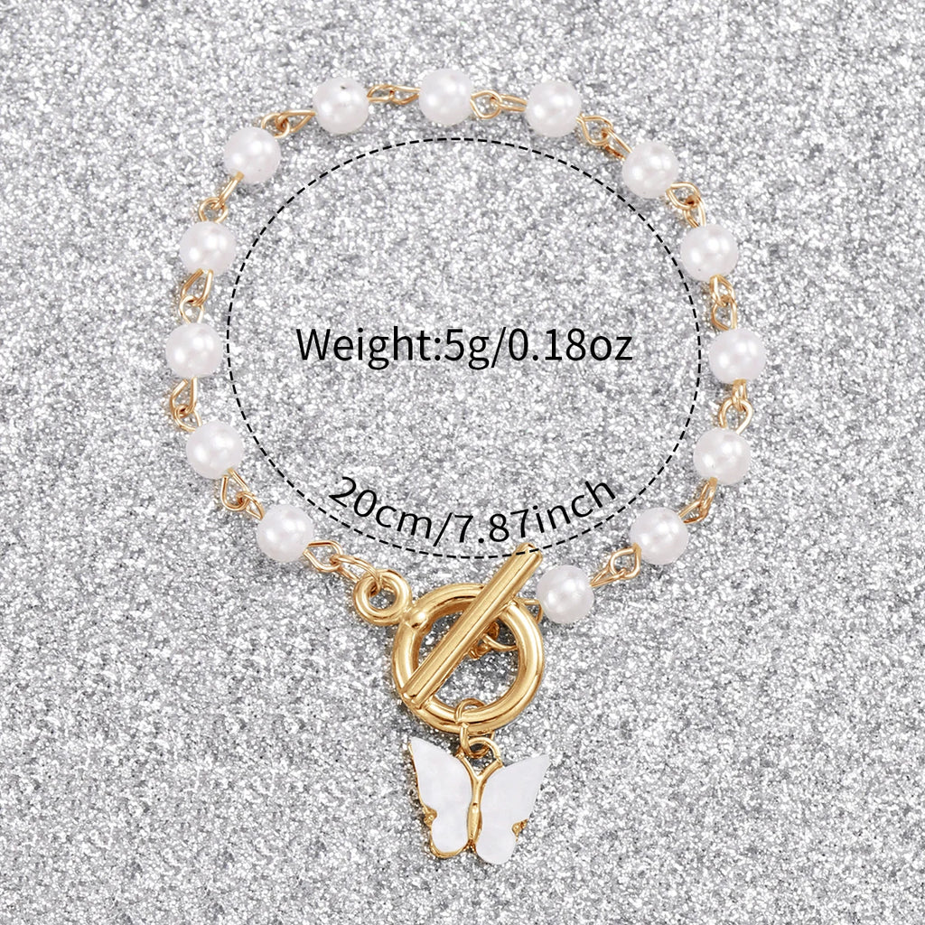 Conjunto feminino relógio analógico de quartzo com pérolas e pulseira de borboleta.